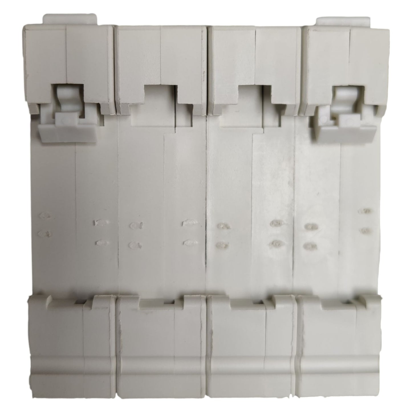Stack of gray plastic components on a white background