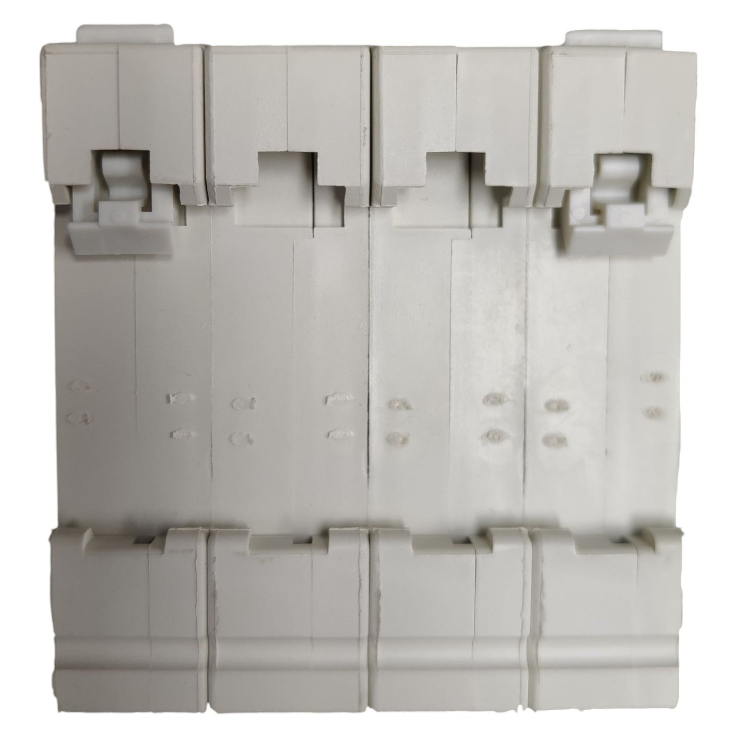 Stack of gray plastic components on a white background