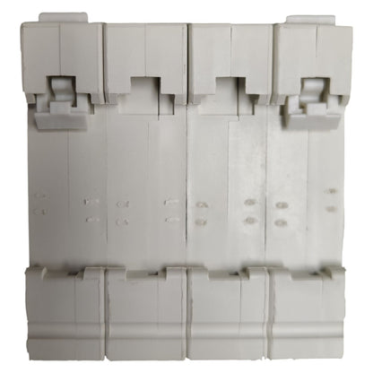 Stack of gray plastic components on a white background