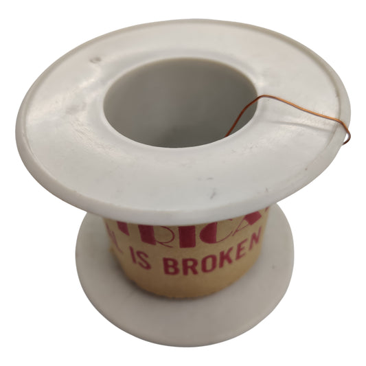 White thread spool with a cardboard core displaying 'America is Broken' text on a white background Magnet Wire (AWG 43) 0.053 mm 500 Grams Approx 17857.14 Meters Length ELectx Electrical SUpply