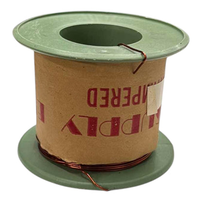 A spool of copper wire wound around a brown cardboard core with green plastic end caps, photographed on a white background.