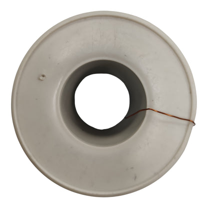 A circular off-white plastic or ceramic ring-shaped component with a central hole and a thin copper wire wrapped around it, shown on a plain white background.