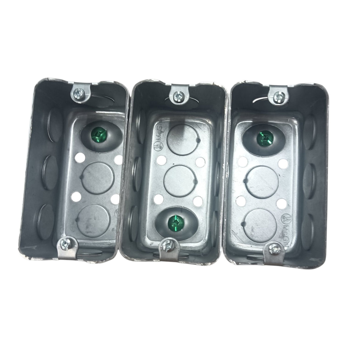 Three gray metal electrical junction boxes shown side-by-side on a plain white background.