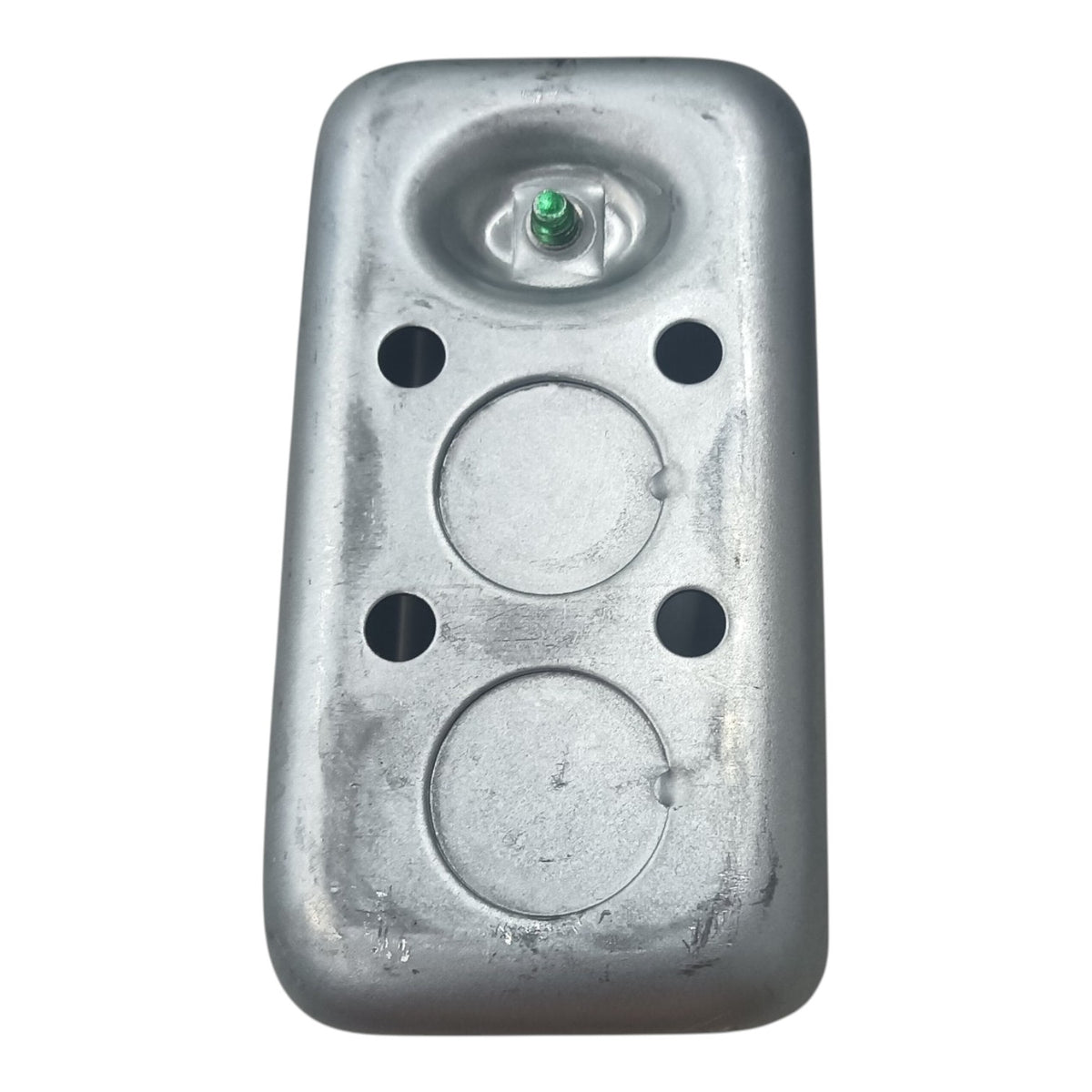 A rectangular galvanized steel metal component, likely a pump cover or housing, featuring a central circular recess with a small green cap, four pre-drilled mounting holes, and a textured metallic finish, shown against a plain white background.