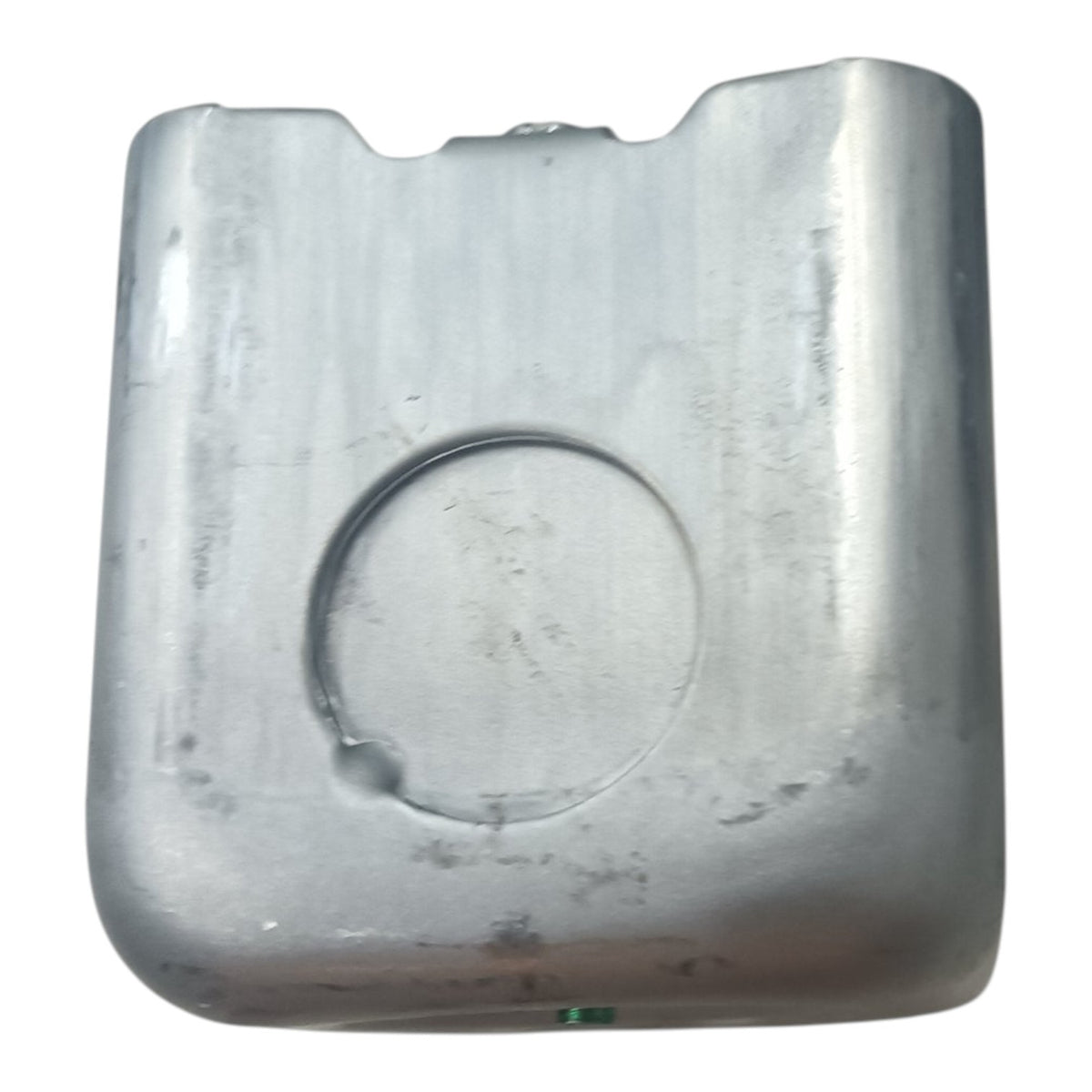 A used silver metal fuel tank with a circular cutout on the front, shown against a plain white background.