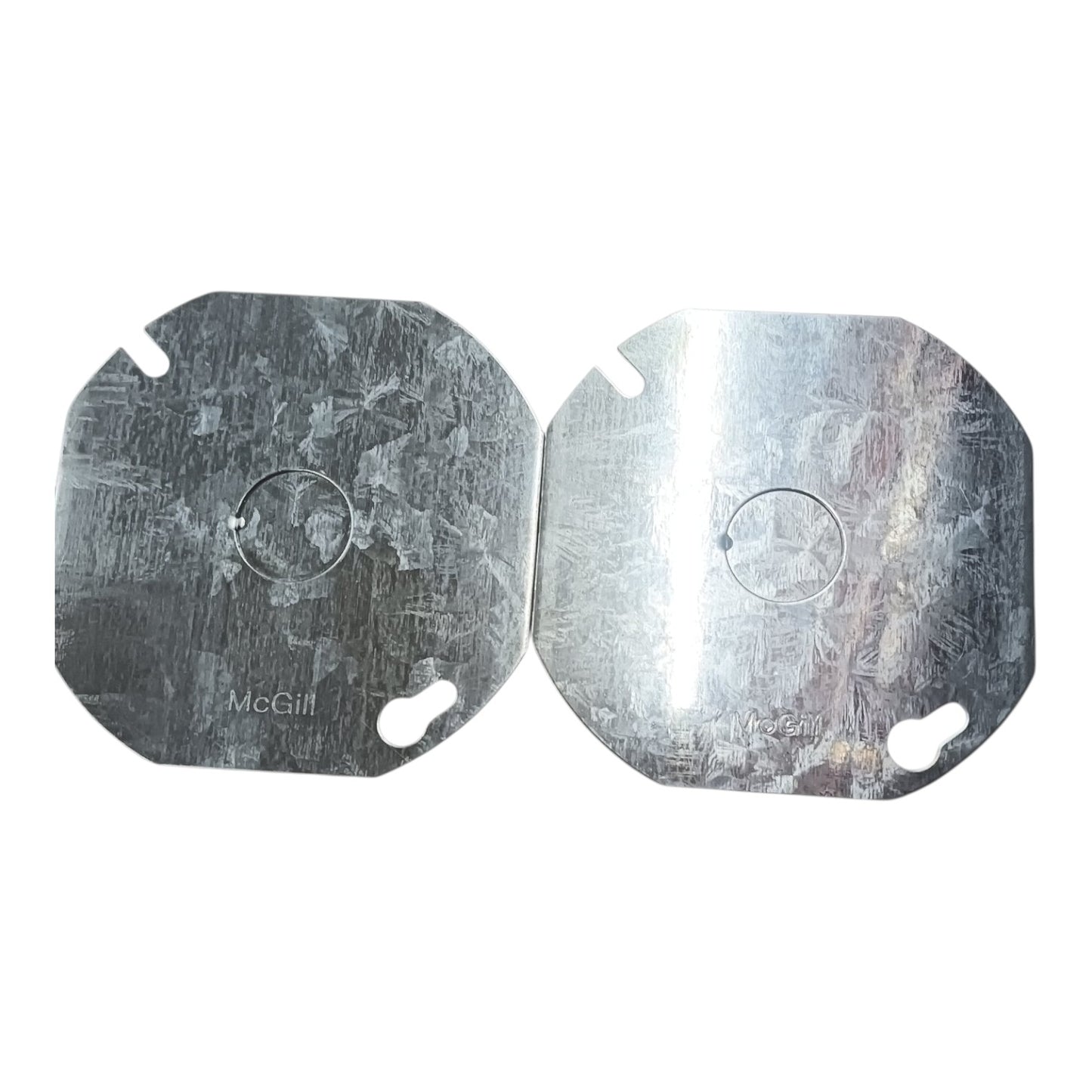 Two metallic silver octagonal replacement pads with rounded corners, featuring a circular cutout in the center and two small keyhole-shaped slots near the bottom, shown on a white background.