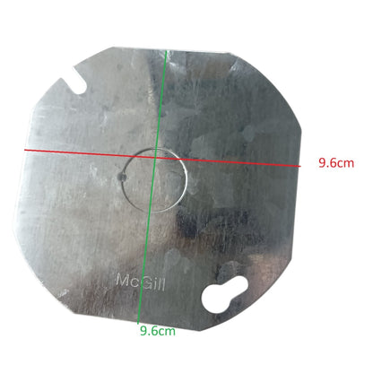 A metallic round metal plate with a central circular cutout and two small slot holes, shown on a white background with red and green dimension lines indicating a 9.6 cm diameter measurement.