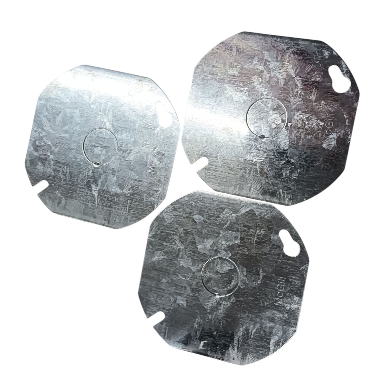 Three square metal plates with rounded corners and a circular cutout in the center, arranged on a plain white background.