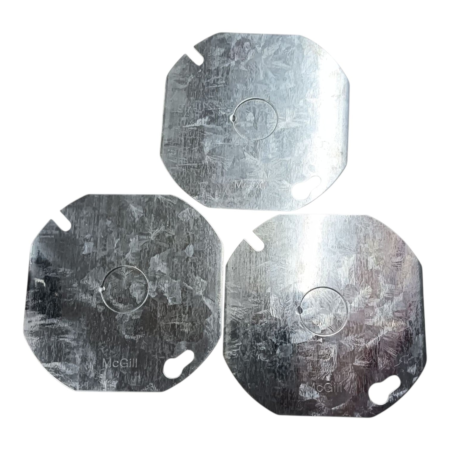 Three square metal replacement plates with rounded corners and two cutouts, arranged in a triangle on a white background. The plates have a brushed metallic texture and are branded with 'McGill'.