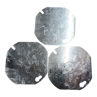 Three square metal replacement plates with rounded corners and two cutouts, arranged in a triangle on a white background. The plates have a brushed metallic texture and are branded with 'McGill'.