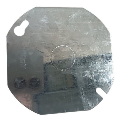 A square metal plate with rounded corners, featuring a pre-drilled circular hole in the center and two key-shaped slots near the top-left and bottom-right corners, shown on a white background.