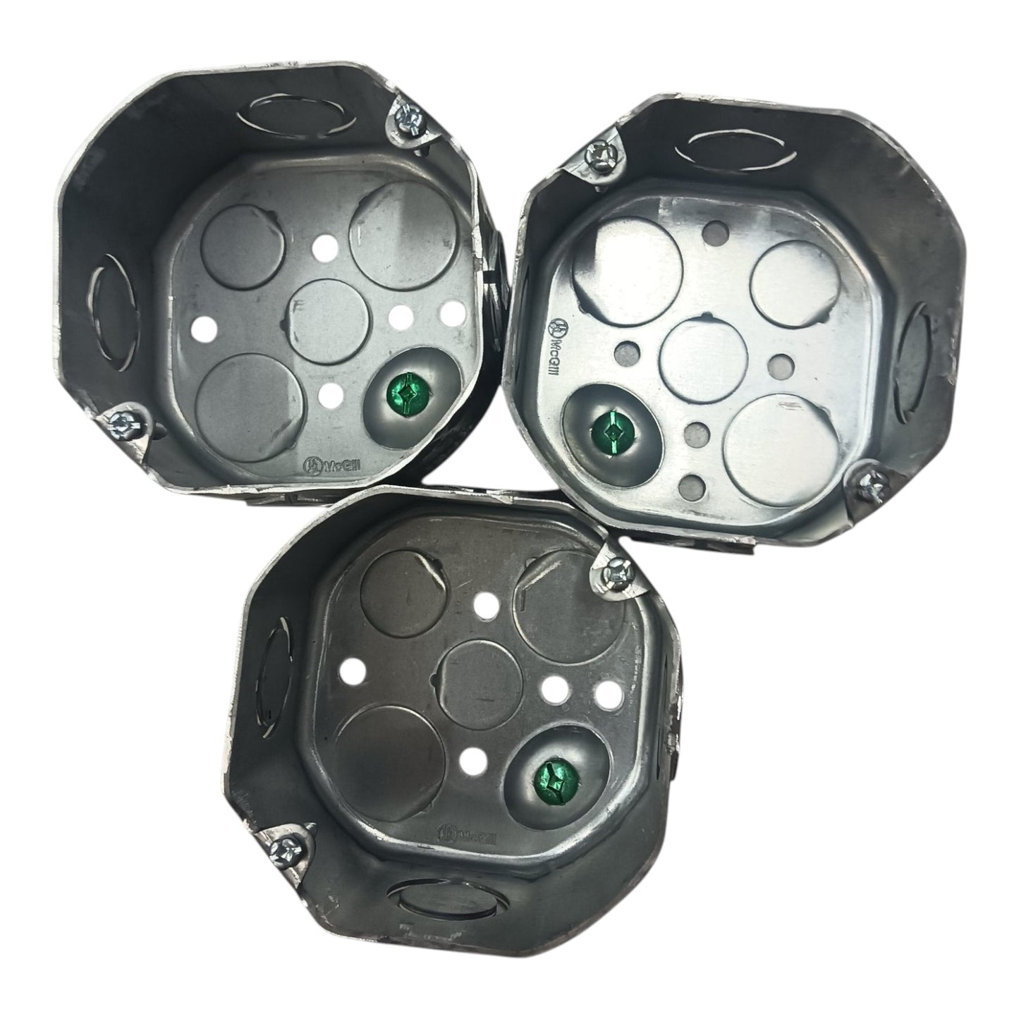 Three metallic octagonal mounting brackets or trays with circular cutouts and small green circular details, arranged on a plain white background.