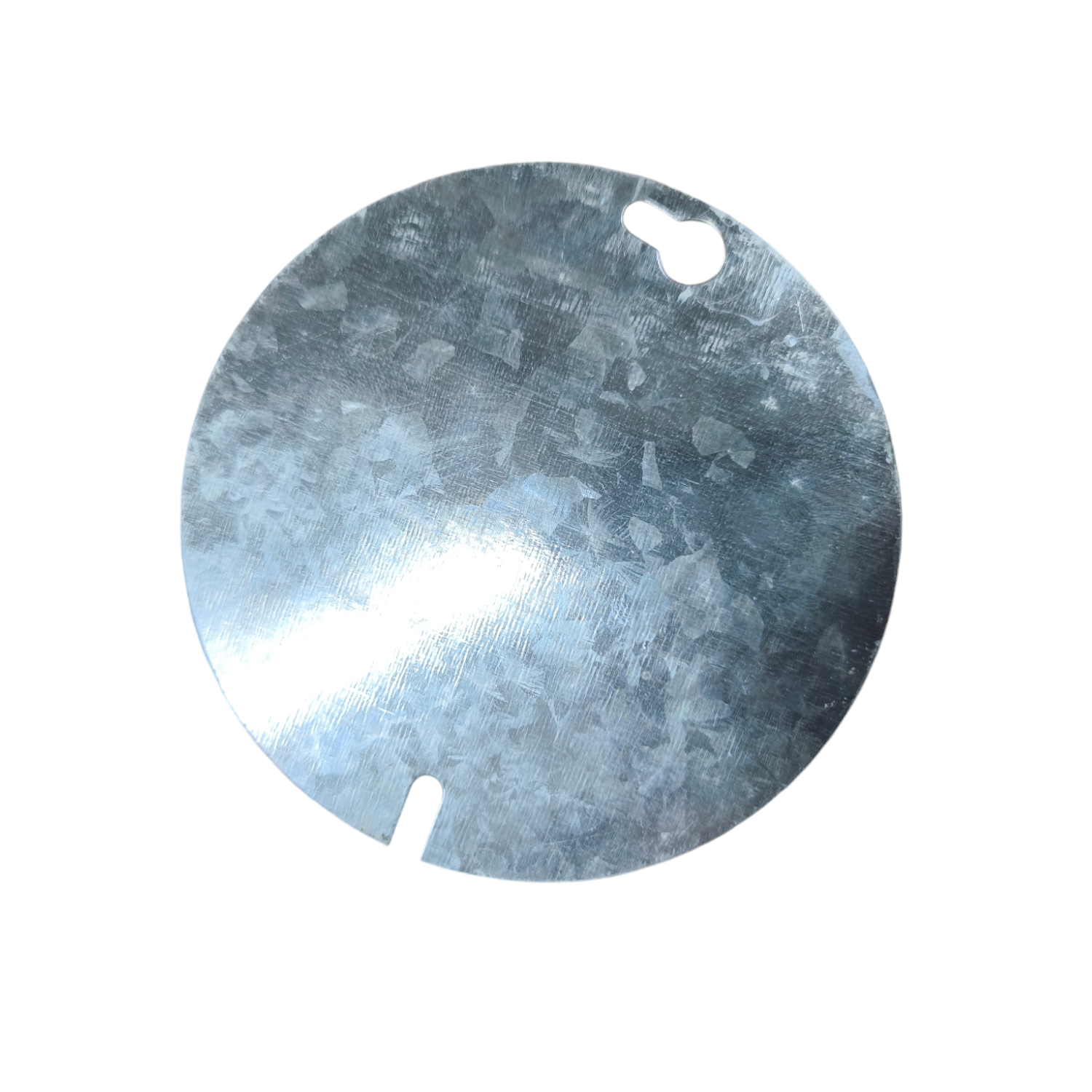 Round metallic object with a central cutout on a white background