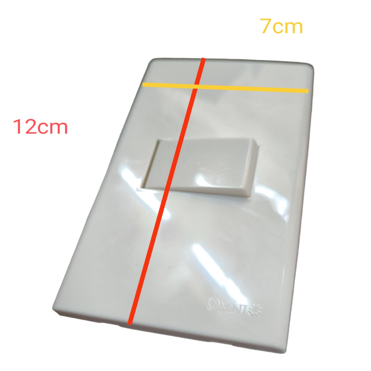 A glossy white electrical switch plate with a toggle switch, overlaid with red and yellow measurement lines and text indicating dimensions of 12cm, 7cm, and 3.5cm.