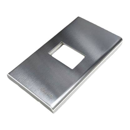 A brushed stainless steel light switch plate cover with a rectangular cutout, shown at an angle on a white background.