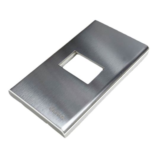 A brushed stainless steel light switch plate cover with a rectangular cutout, shown at an angle on a white background.