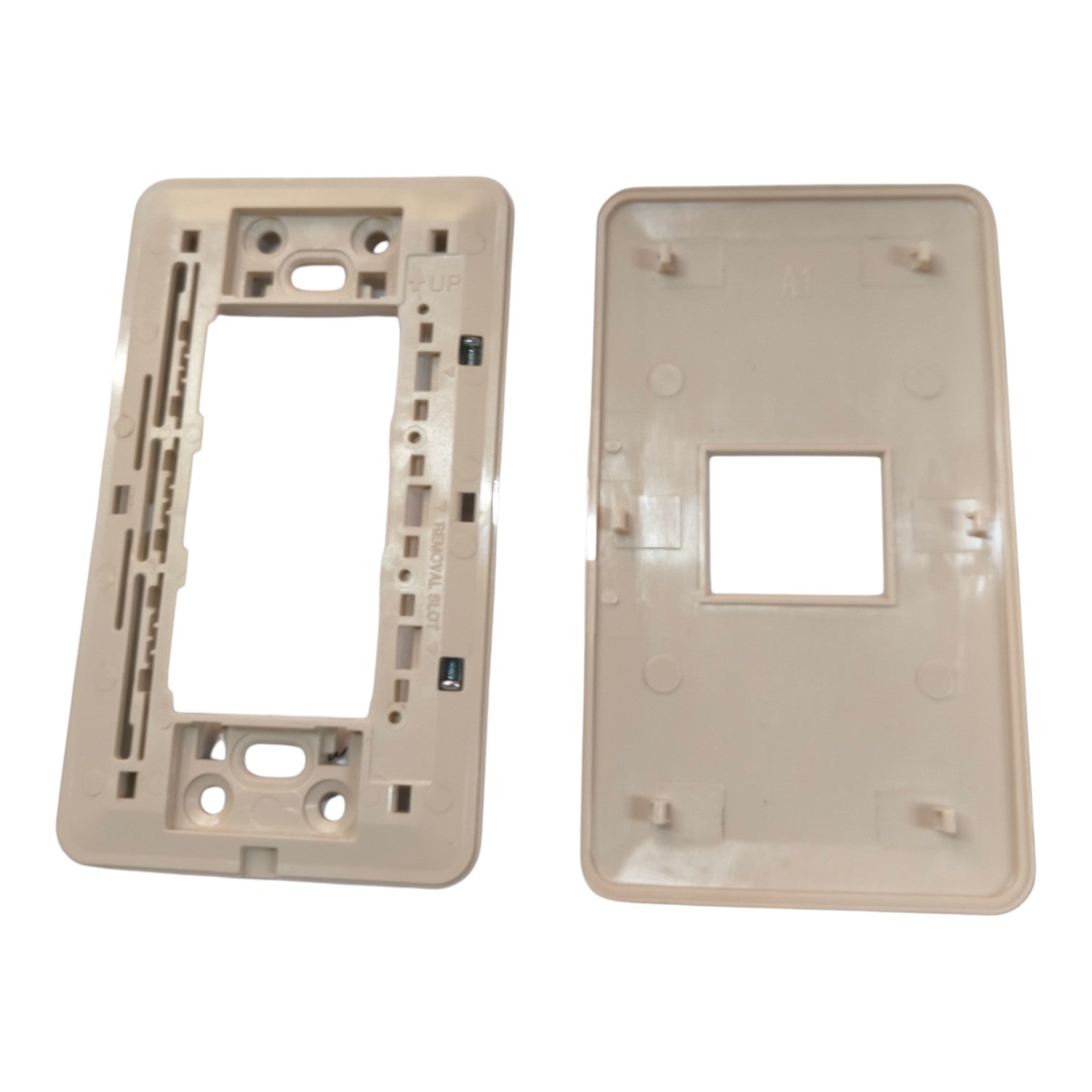 A replacement light switch plate set consisting of a beige mounting frame on the left and a matching beige cover plate on the right, shown against a plain white background.