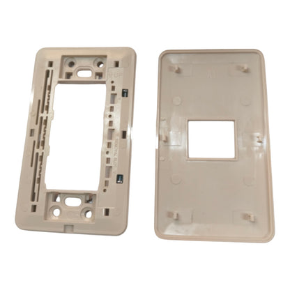 A replacement light switch plate set consisting of a beige mounting frame on the left and a matching beige cover plate on the right, shown against a plain white background.
