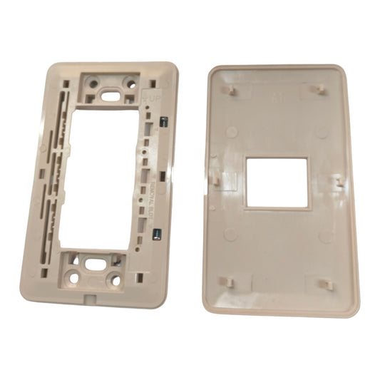 A replacement light switch plate set consisting of a beige mounting frame on the left and a matching beige cover plate on the right, shown against a plain white background.