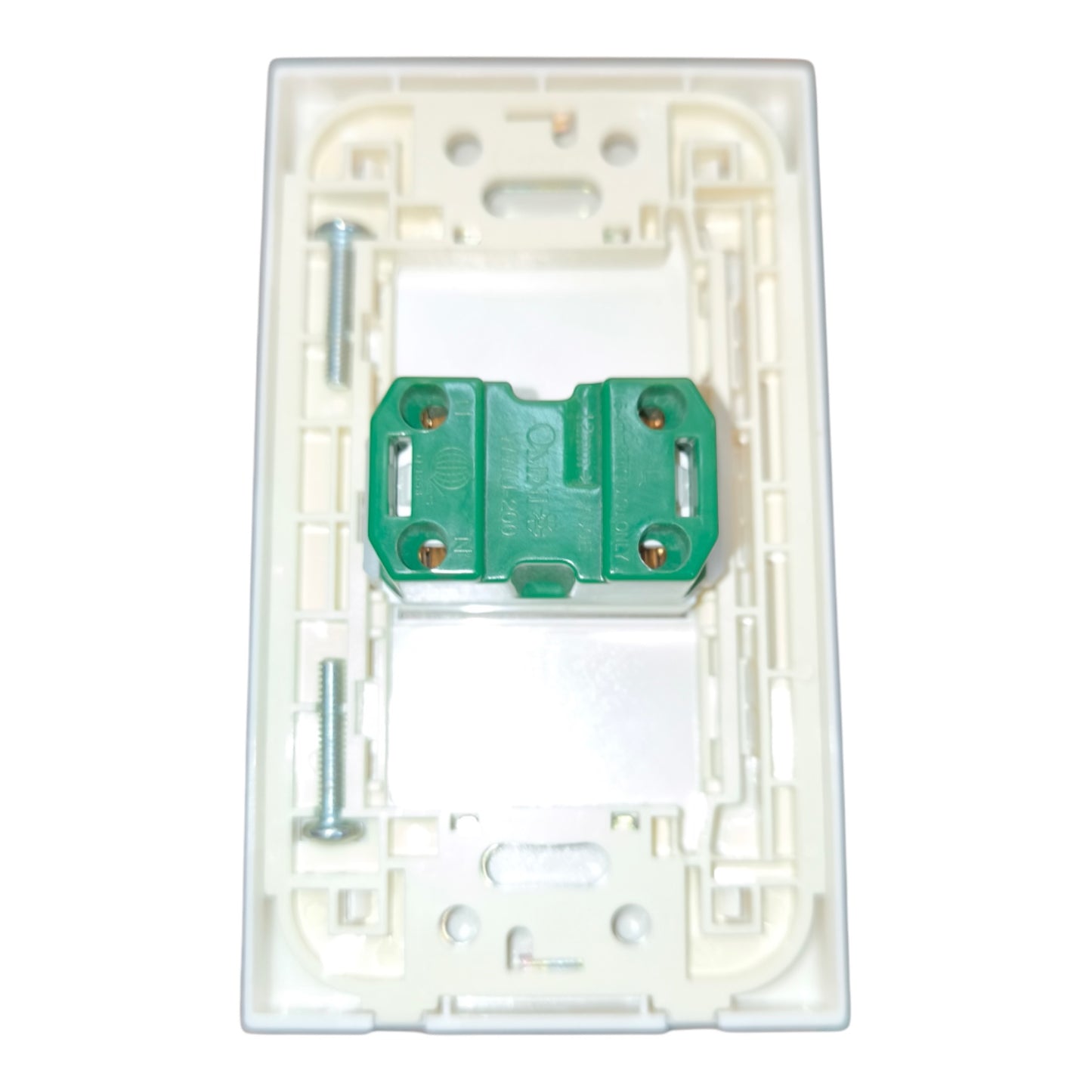 A white plastic electrical switch plate backplate with a green terminal block and mounting screws, shown on a plain white background.