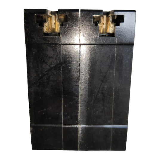 A black plastic dual-cell battery with gold-colored terminal connectors on a plain white background.