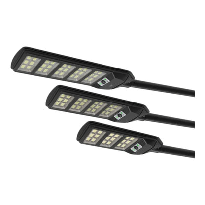 Three black solar-powered LED streetlights arranged diagonally on a plain white background.