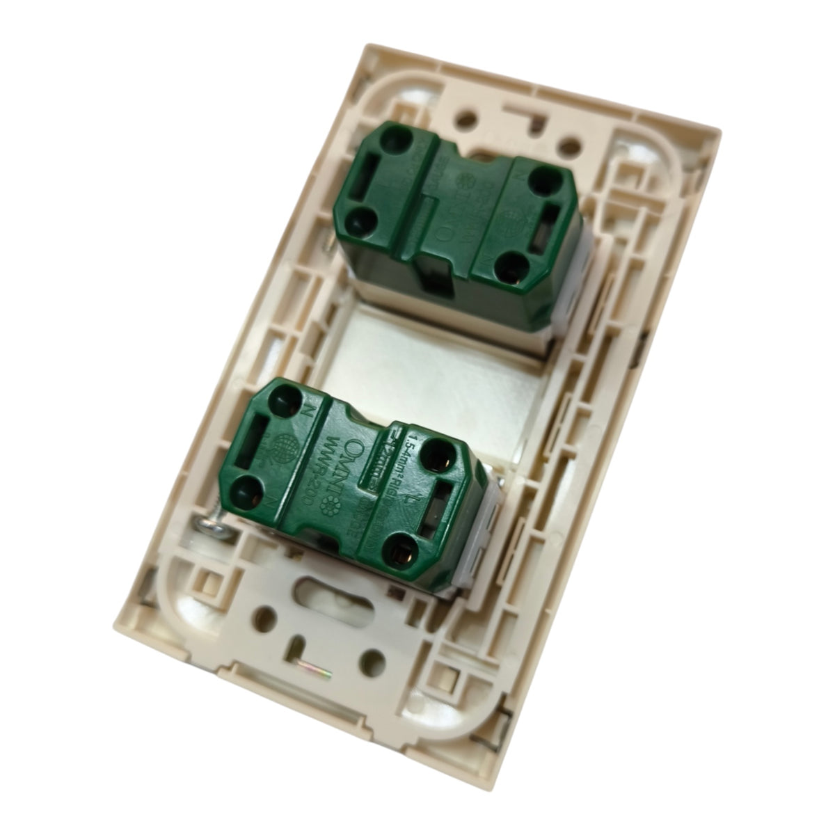 A dual-gang light switch plate cover in beige plastic with two green terminal blocks, shown on a plain white background.