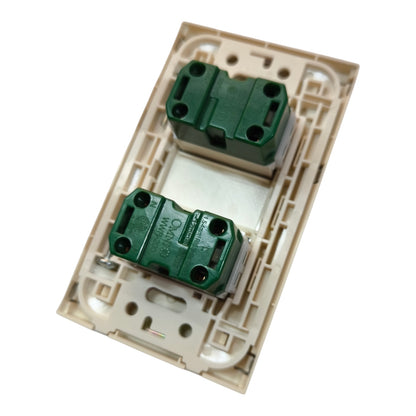 A dual-gang light switch plate cover in beige plastic with two green terminal blocks, shown on a plain white background.