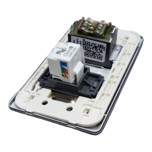 An open electrical wall switch module showing internal components, including a white CAT6 RJ45 network module, a black terminal block, and a green terminal block, set against a plain white background.