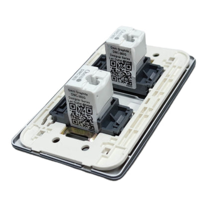 Two Gemi-Graphix DHC-5000 smart switch modules installed on a white plastic backplate of a double-gang wall switch, shown against a plain white background.