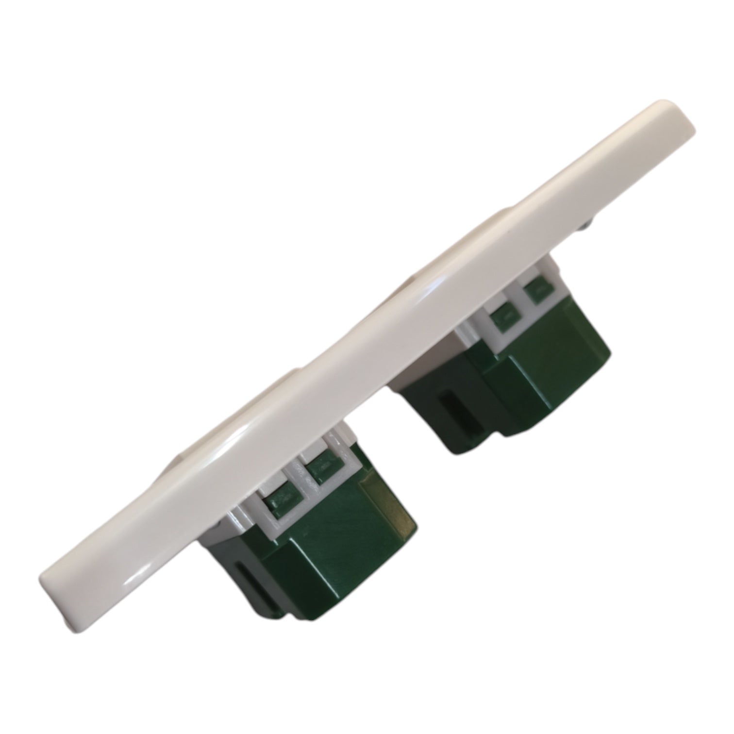 A white plastic wall switch plate with two green and white electrical outlet sockets, shown on a plain white background.