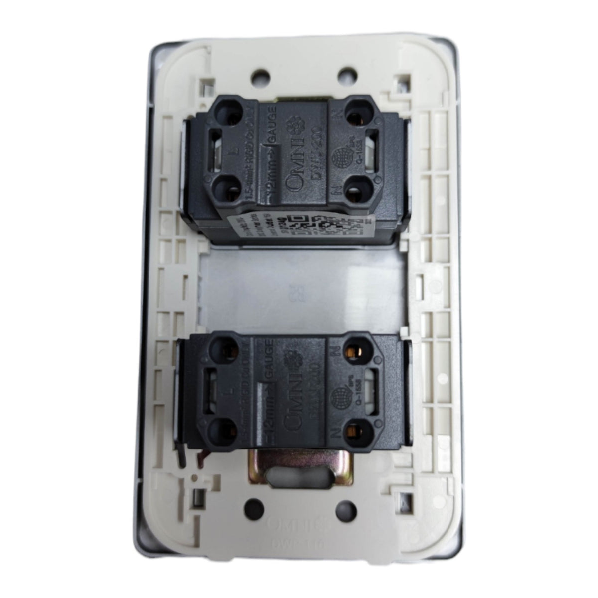 A close-up of a white electrical wall switch plate showing the internal components, including two black contact blocks and a central silver spring, on a white background.