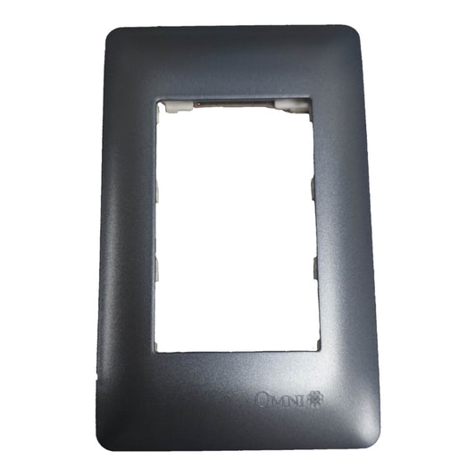 A dark gray rectangular electrical outlet cover plate frame with a central cutout and the 'OMNI' brand logo embossed at the bottom right, shown on a plain white background.