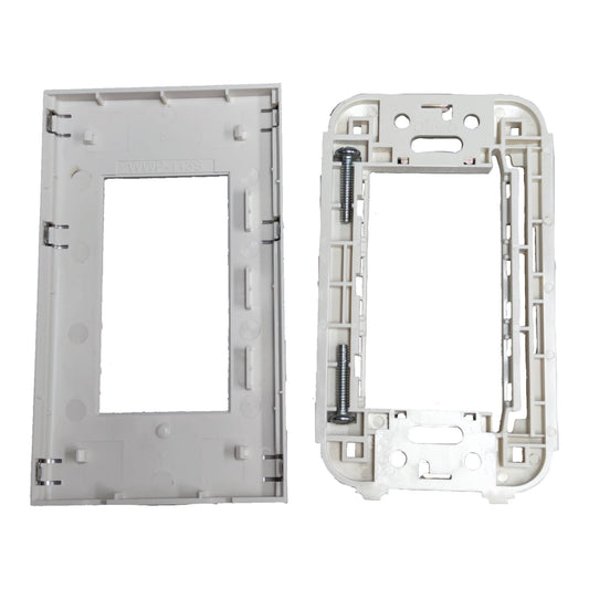 A pair of white plastic electrical wall switch plate frames, one showing the front face and the other showing the back side with mounting holes and a screw.