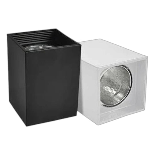 Two modern square recessed light fixtures shown side by side on a plain white background, one in matte black and one in matte white, both with visible silver reflectors.