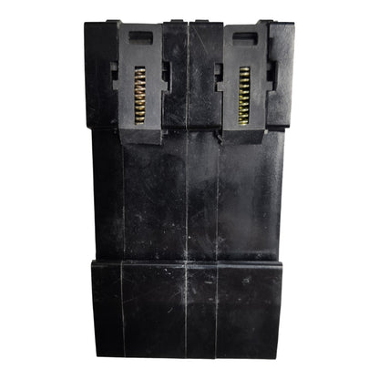 A black plastic multi-connector plug or adapter component with gold-toned metal pins visible in two vertical slots, shown against a plain white background.