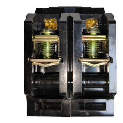 A close-up of a black electrical terminal block connector with two gold-colored screw terminals and translucent amber-colored insulators, isolated on a white background.