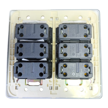 A 6G1 three-way double switch plate with six dark gray electrical contact points arranged in two columns of three on a cream-colored plastic backplate.