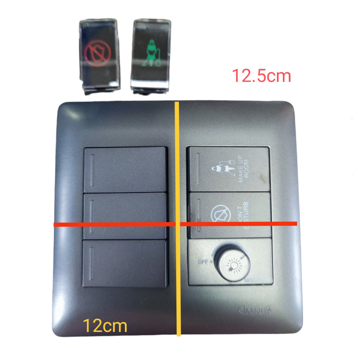 A square dark gray wall switch panel with two rows of three rocker switches on the left and three control buttons on the right, including a round dial. Red, yellow, and black dimension lines and text labels indicate measurements of 12cm and 12.
