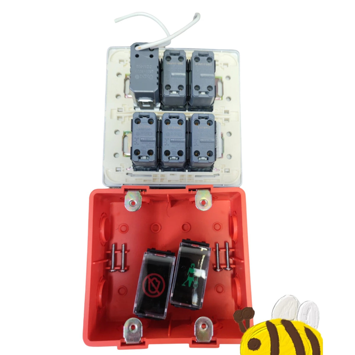 An electrical junction box with a red plastic lower compartment and a clear upper tray holding six gray contact modules, shown open on a white background with a small bee toy partially visible in the bottom right corner.