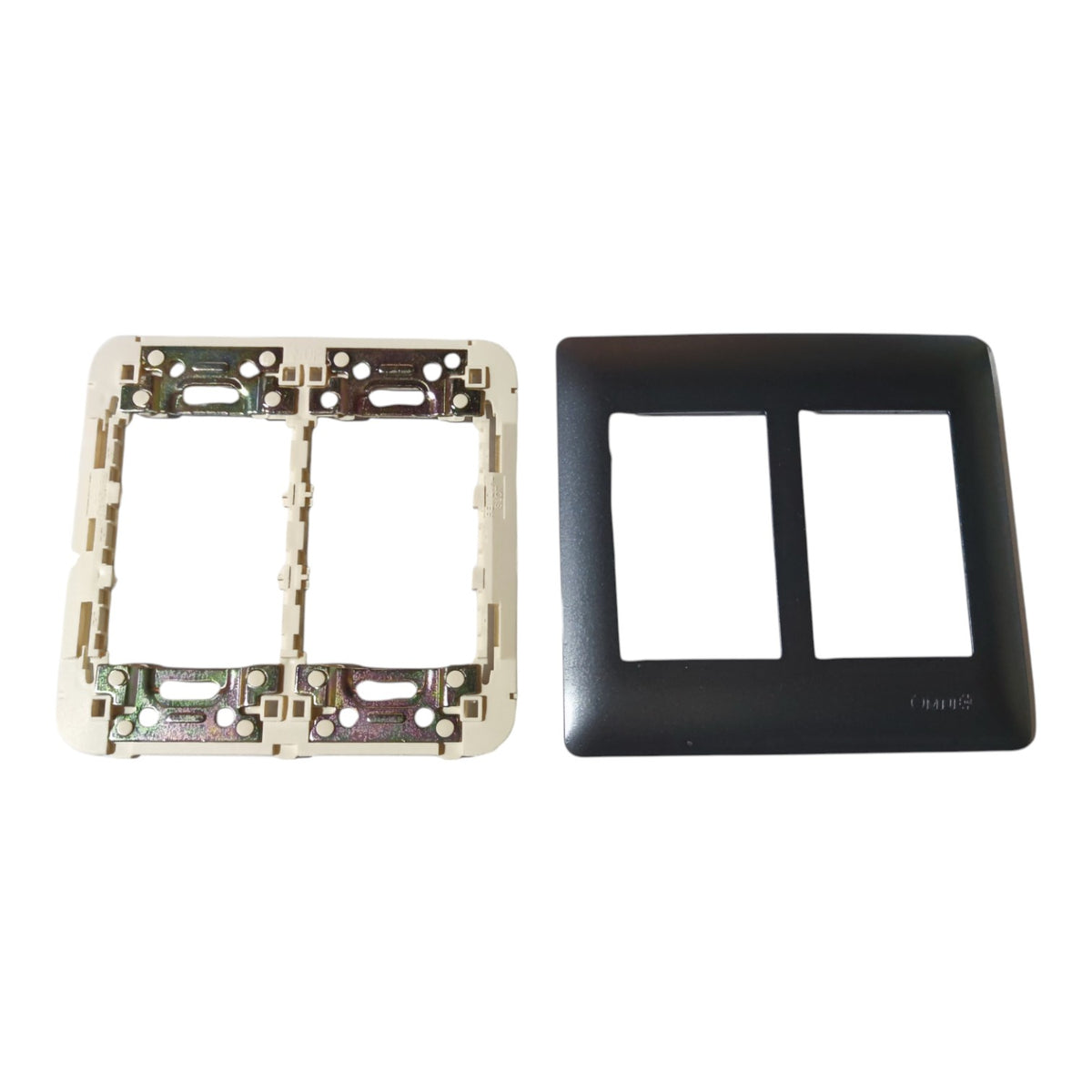 A two-gang double socket electrical wall plate kit showing a black front cover plate on the right and the internal white backplate with circuitry on the left, set against a plain white background.