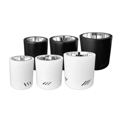Five cylindrical cup-like containers arranged on a white background, with three black outer bodies and two white outer bodies, each with a metallic silver interior.