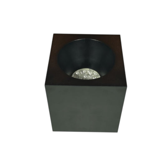 A modern square black LED light fixture with a recessed circular cup and a clear faceted crystal diffuser, shown on a plain white background.