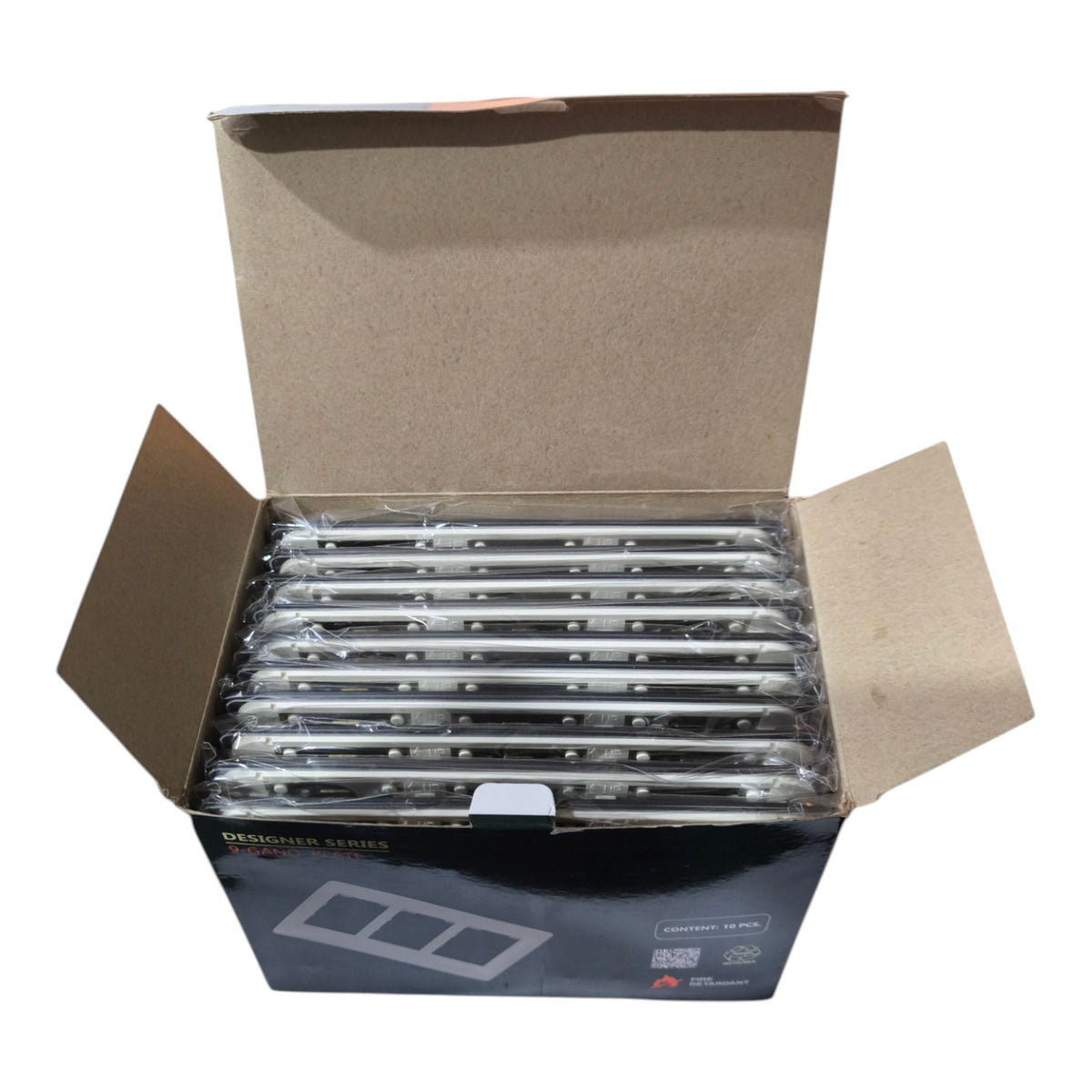 An open cardboard shipping box containing multiple packaged silver rectangular items, photographed on a plain white background.