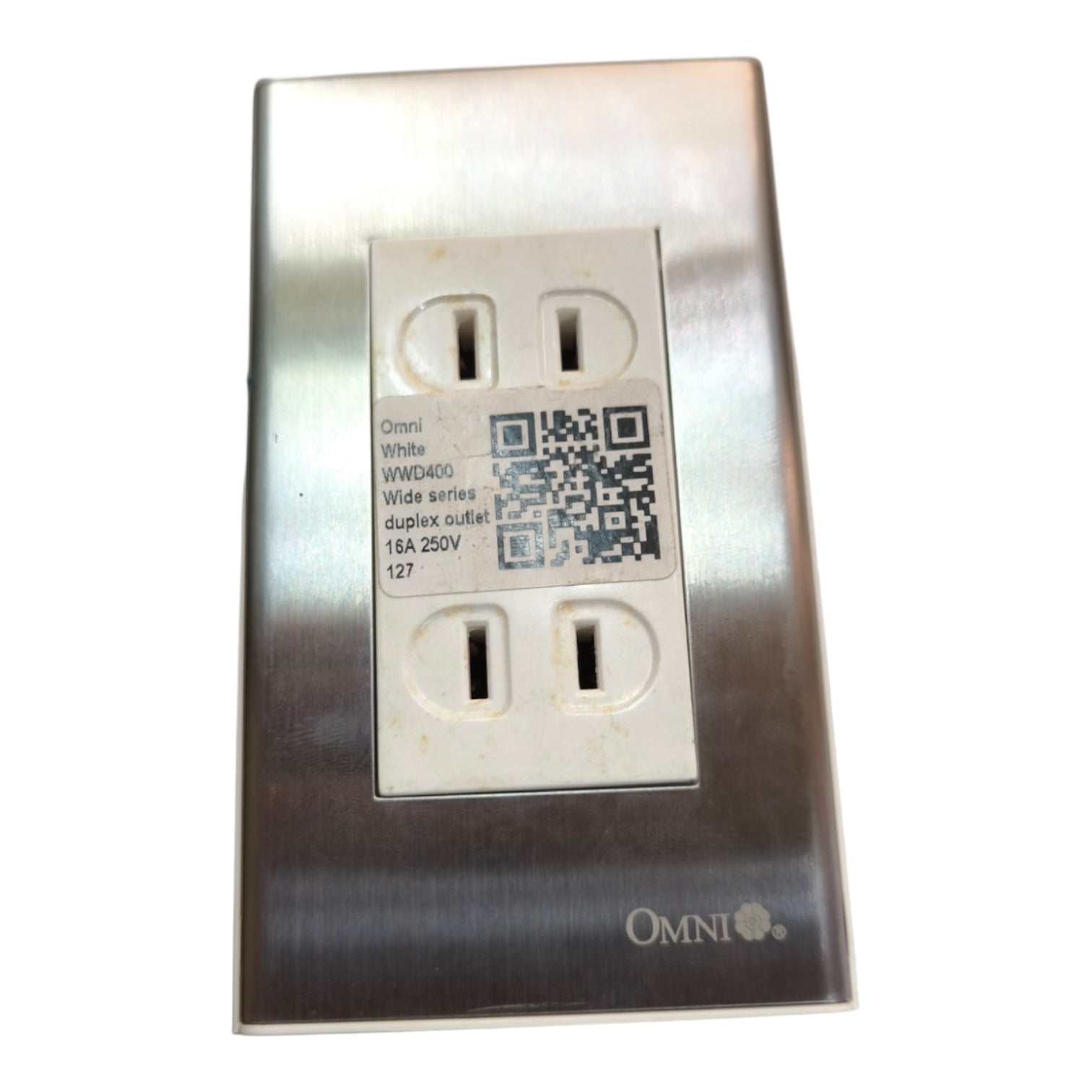 An Omni White WMD450 duplex outlet featuring a brushed stainless steel faceplate and white outlets, shown on a plain white background.
