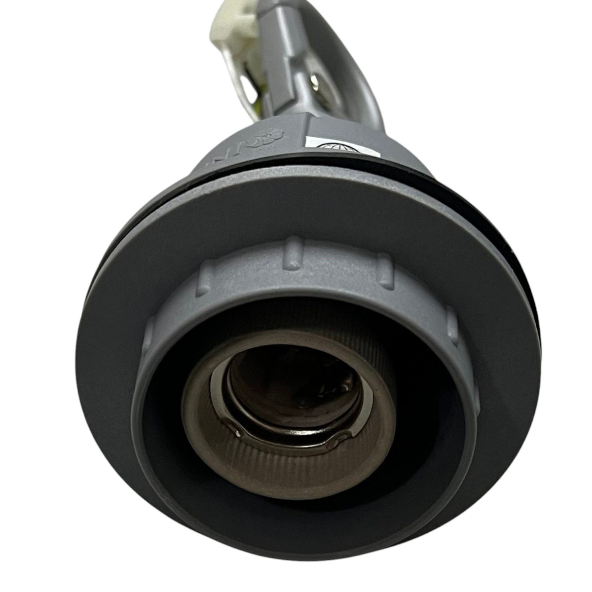 A close-up of a dark gray circular plastic component with a threaded center and a small white label, photographed on a plain white background.