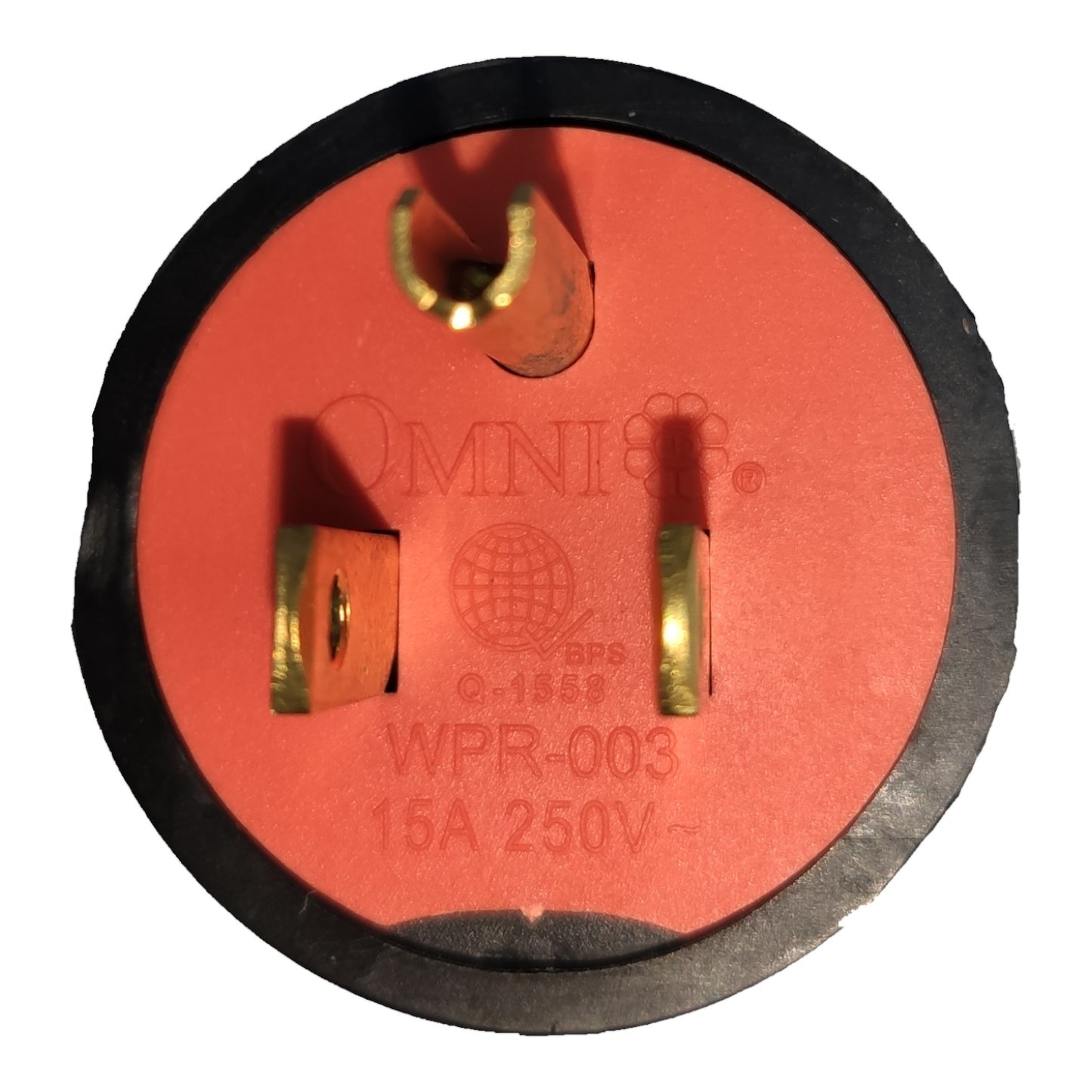 An Omni brand 15A 250V WPR-003 outdoor weatherproof outdoor outlet plug with a red face, black rubber frame, and gold-plated metal pins.