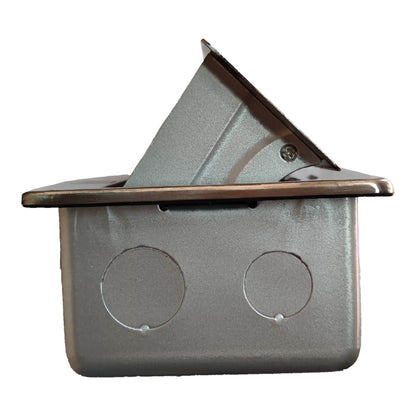 A silver metal electrical junction box with a triangular metal cover partially open, featuring two circular entry terminals on the front, isolated on a white background.