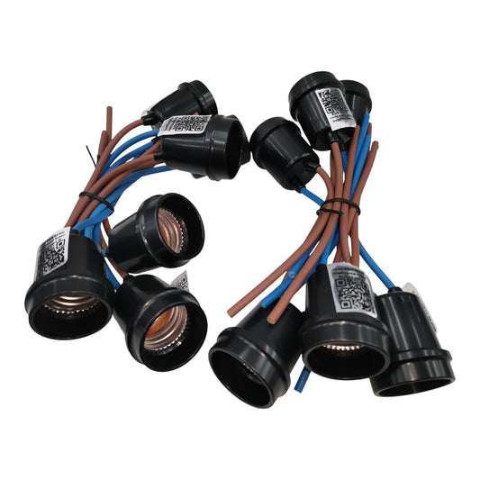 Set of black light bulb sockets with wiring on a white background