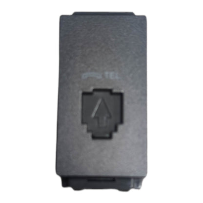 A black rectangular plastic RJ45 connector cover with a pixelated arrow symbol and a faint 'TEL' logo printed on the front, isolated on a white background.